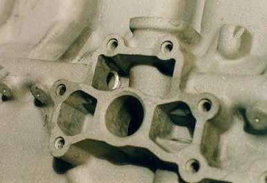 Oil pump mounting with radiused oil galley