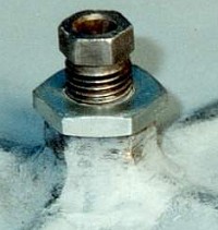 Positive cam stop or "button" made from a SL6 rocker arm adjuestment screw