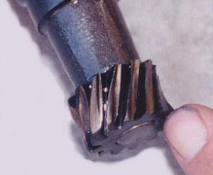 Gear teeth wear down before "stripping" and nicking the cam gear